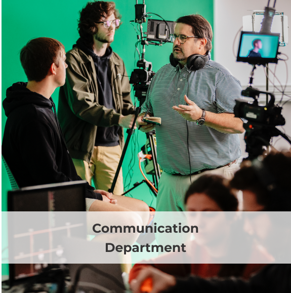 communication students with camera