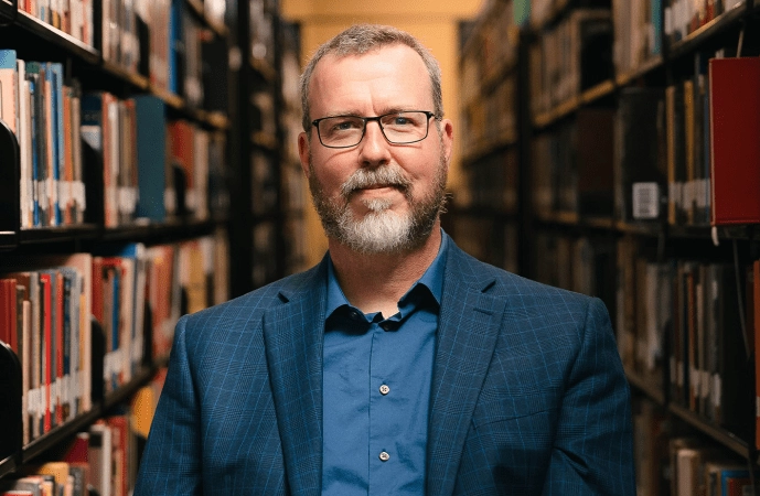Nathan J. Cox in library