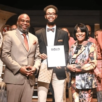 Student in suit and bow tie
