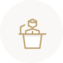 Person behind a podium golden icon