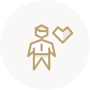 Person next to a large heart golden icon