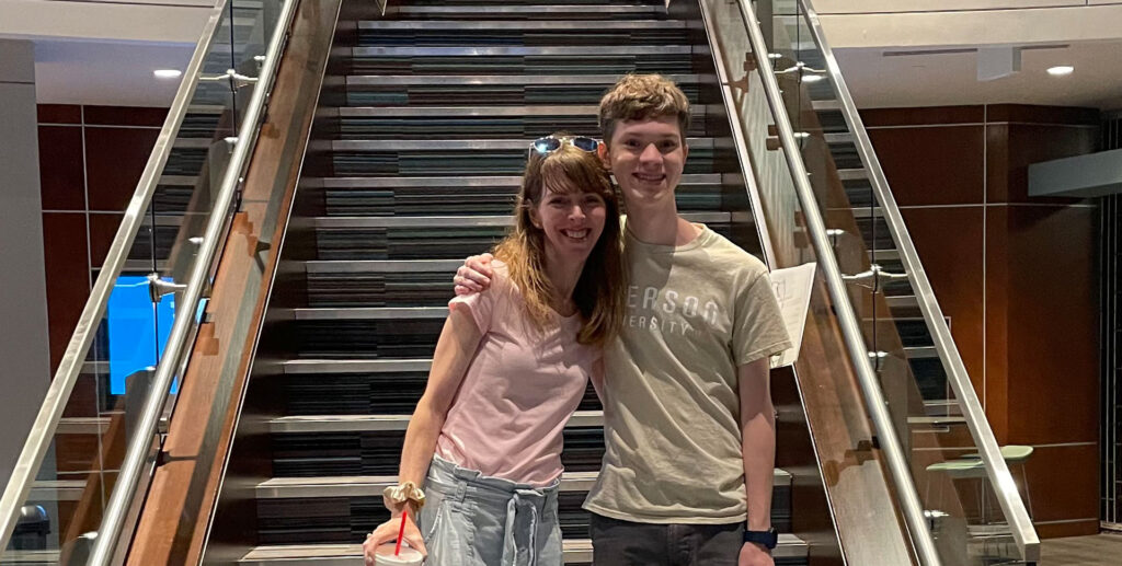 Mom and son at the bottom of student center stairs