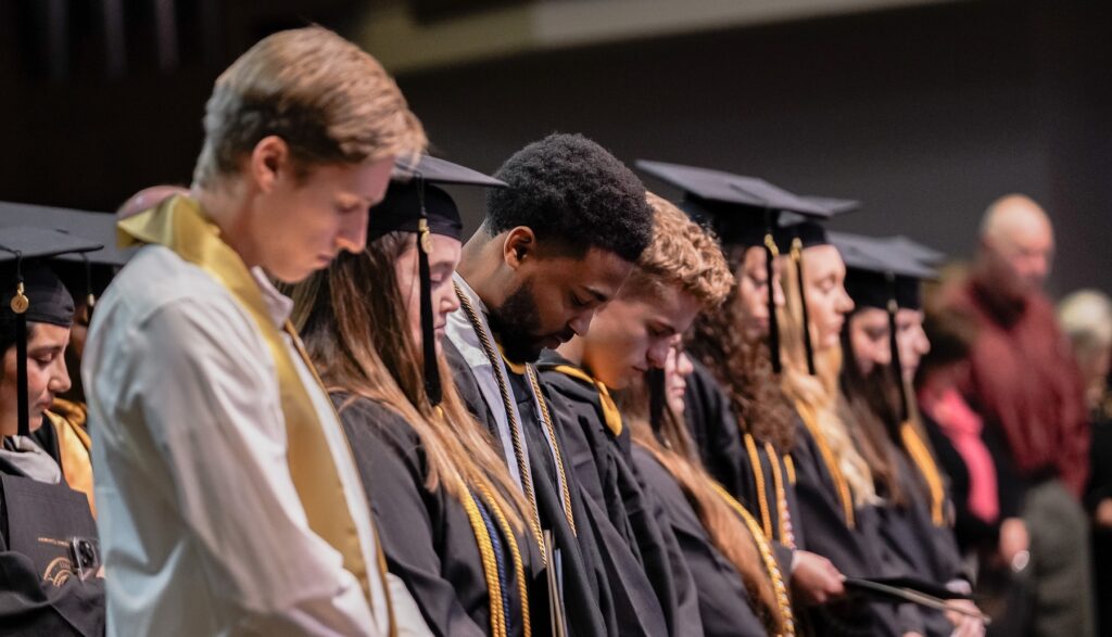 Graduates praying