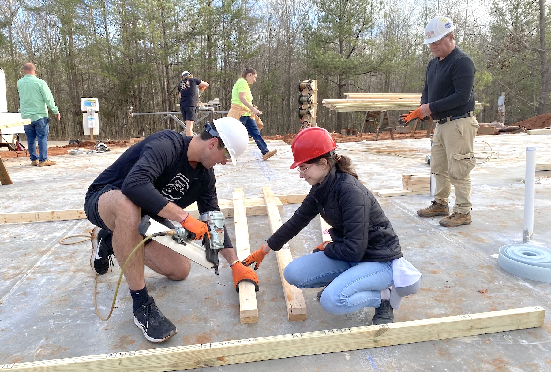 Anderson University students working on frame for Habitat home