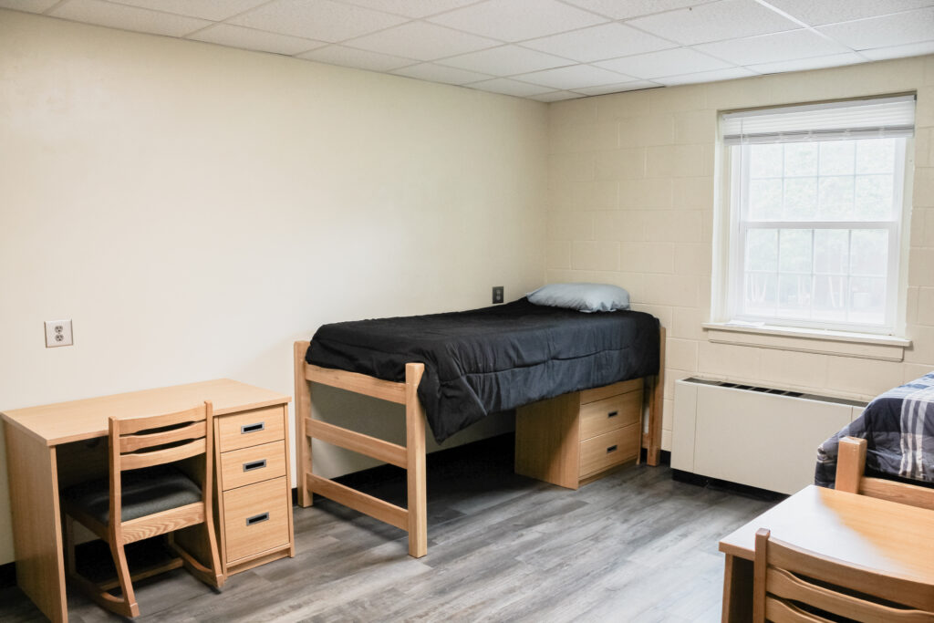 Rouse Suite Residence Halls bedroom with bed and window