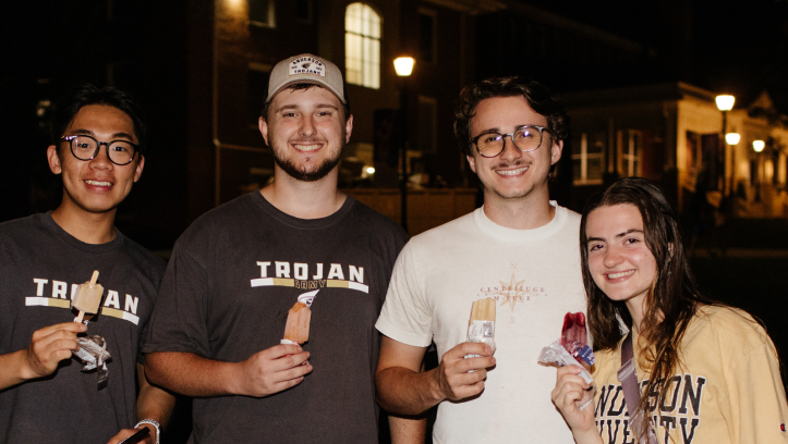 Prospective students standing with popsicles