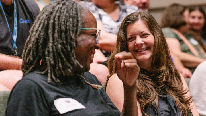 two adults laughing