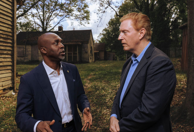 Two men talking outdoors