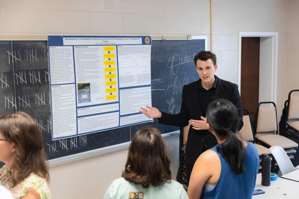 Anderson student, Ryan Davis, presenting his research at the research showcase